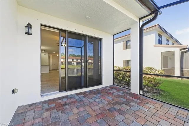 a view of a big room with windows and yard
