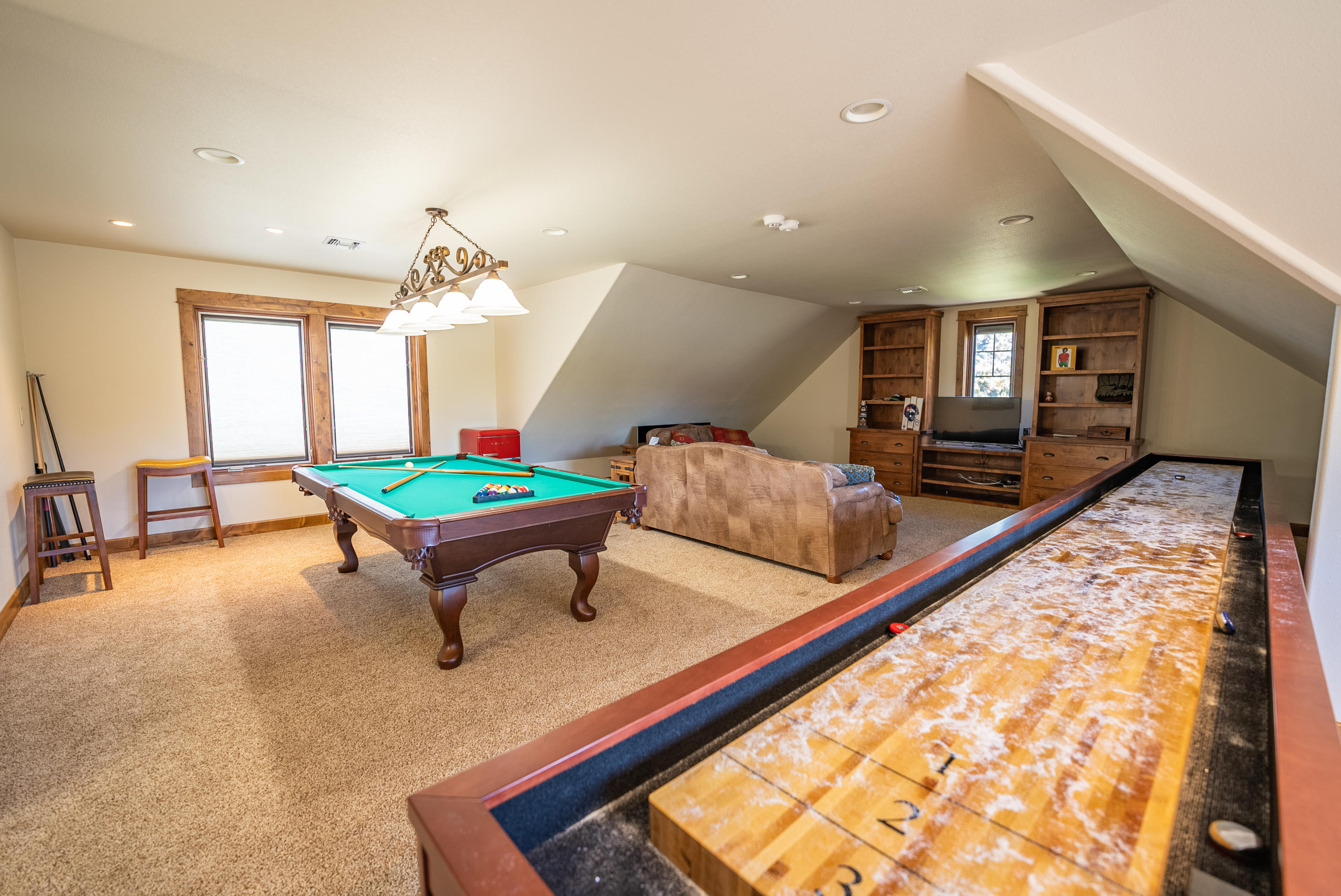 63545 Overtree Road Bend, OR 97701 - Photo 17 of 63 enter into the huge bonus room with pool table and 24' shuffleboard