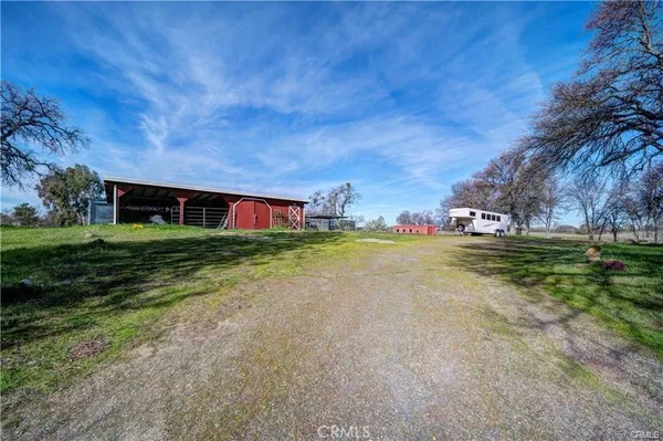 a view of a house with a big yard