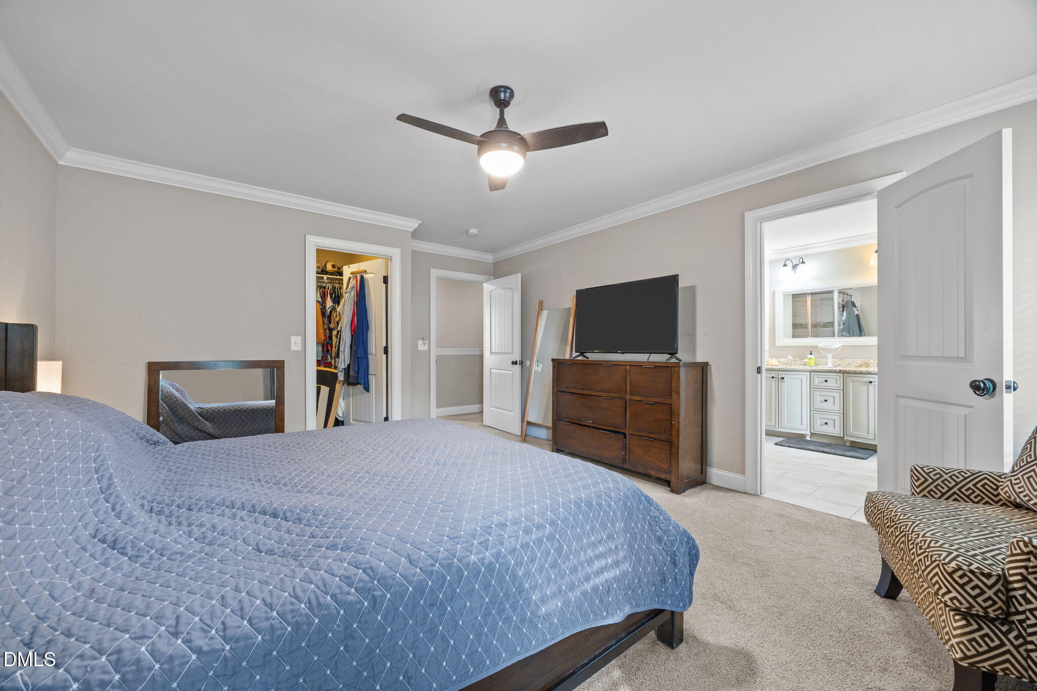 3724 Massey Ridge Court Raleigh, NC 27616 - Photo 13 of 30 a spacious bedroom with a bed and a television in it