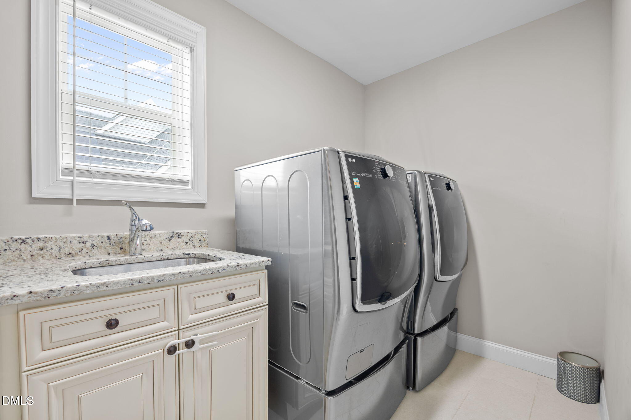 3724 Massey Ridge Court Raleigh, NC 27616 - Photo 20 of 30 a bathroom with a granite countertop sink and a mirror