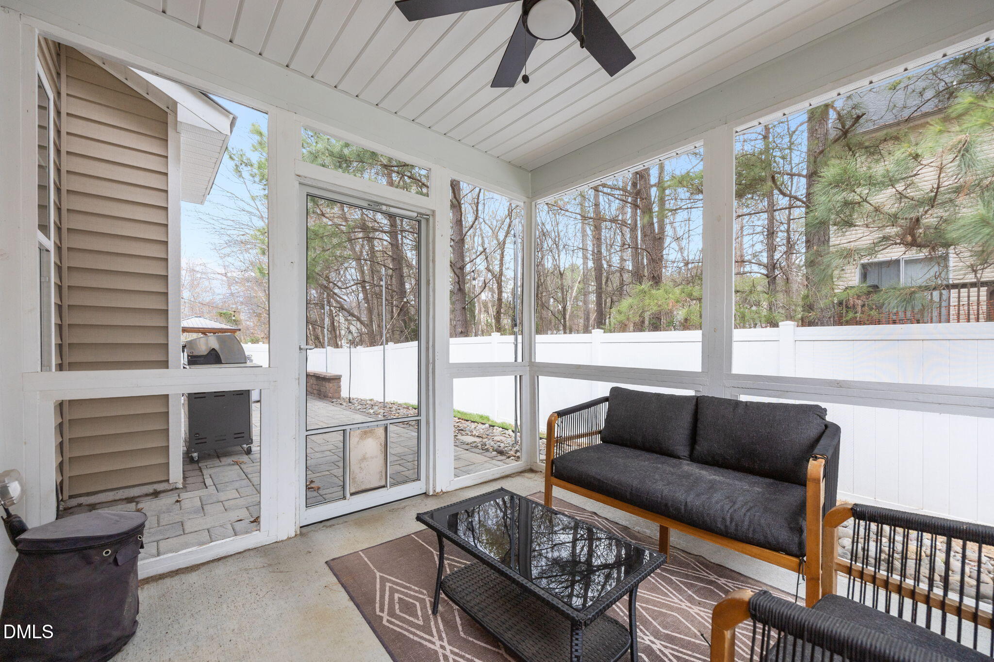 3724 Massey Ridge Court Raleigh, NC 27616 - Photo 22 of 30 a living room with furniture and a floor to ceiling window