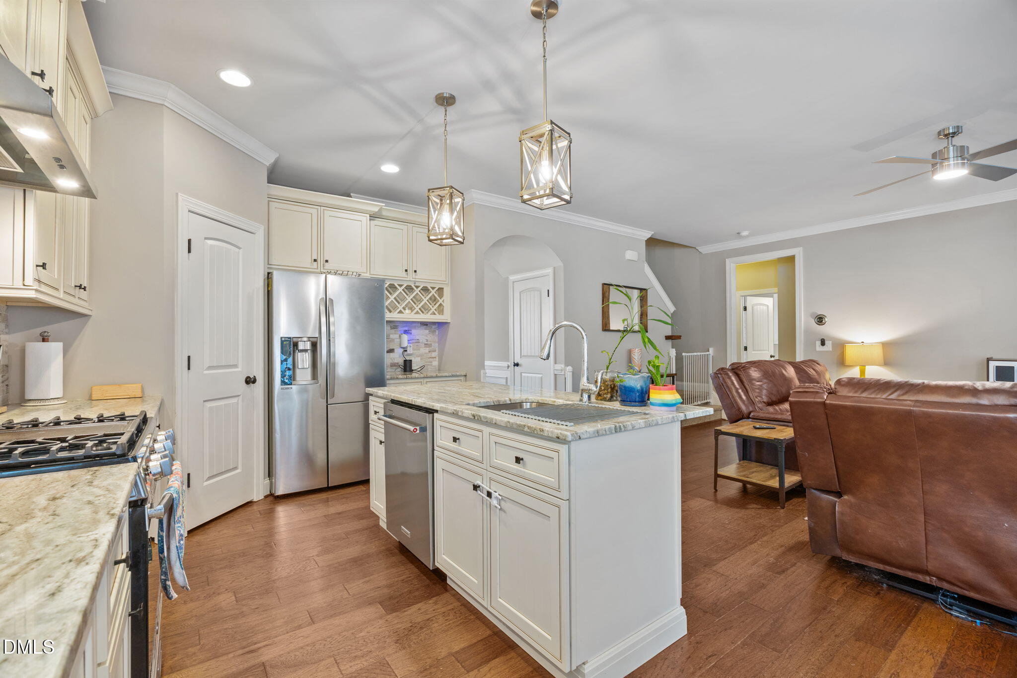 3724 Massey Ridge Court Raleigh, NC 27616 - Photo 4 of 30 a kitchen that has a lot of cabinets in it and wooden floors