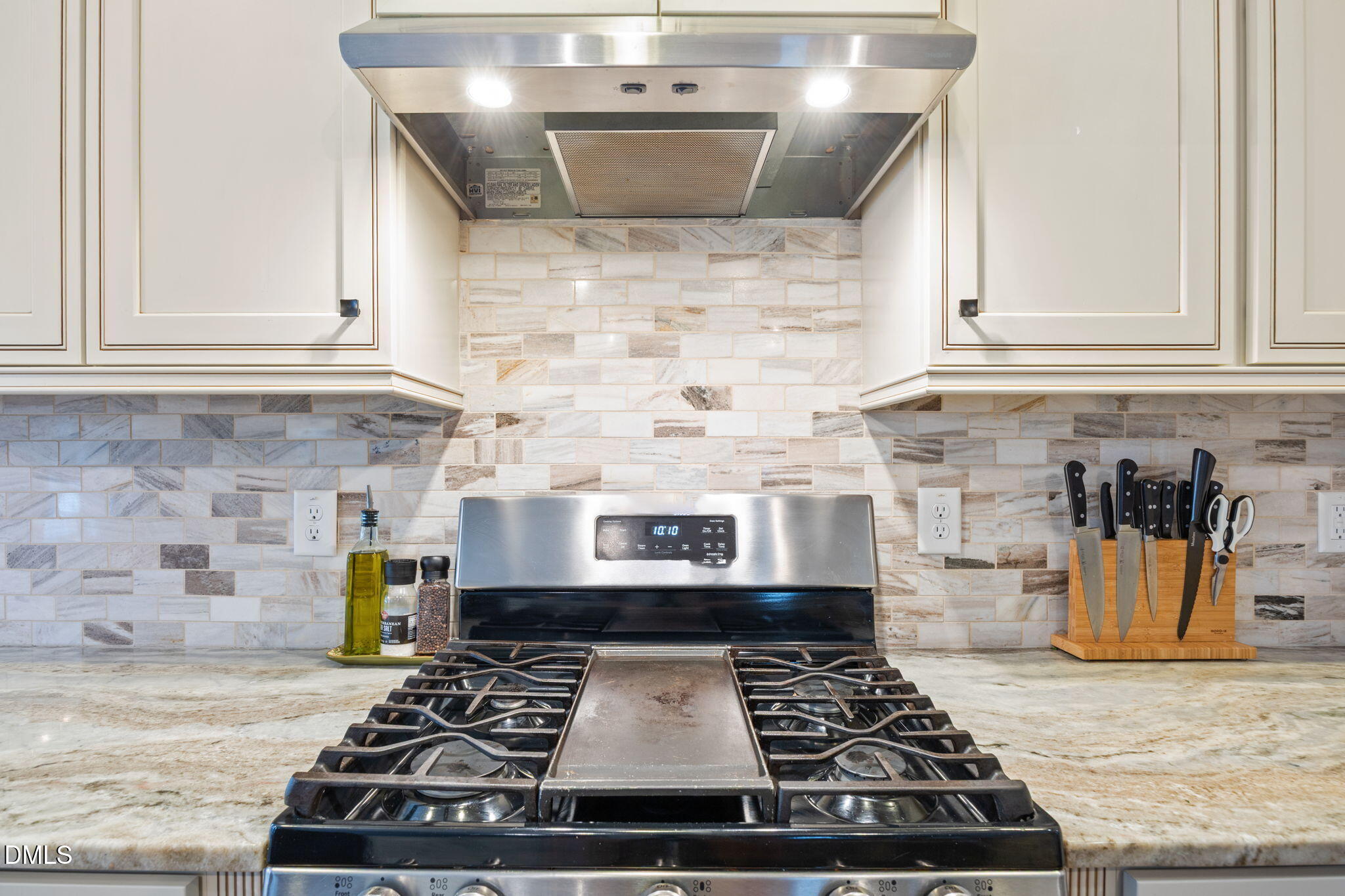 3724 Massey Ridge Court Raleigh, NC 27616 - Photo 5 of 30 a stove top oven sitting inside of a kitchen