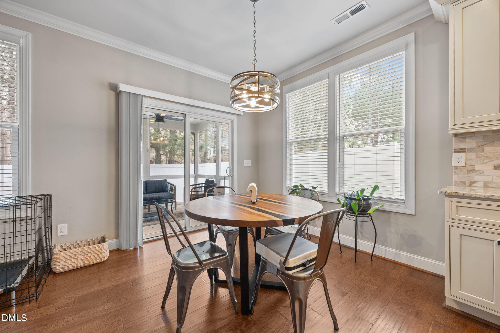 3724 Massey Ridge Court Raleigh, NC 27616 - Photo 6 of 30 a dining room with furniture a chandelier and wooden floor