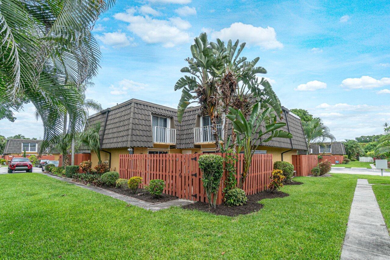 22172 Boca Rancho Drive, Unit D Boca Raton, FL 33428 - Photo 1 of 15 a view of backyard with a garden and plants