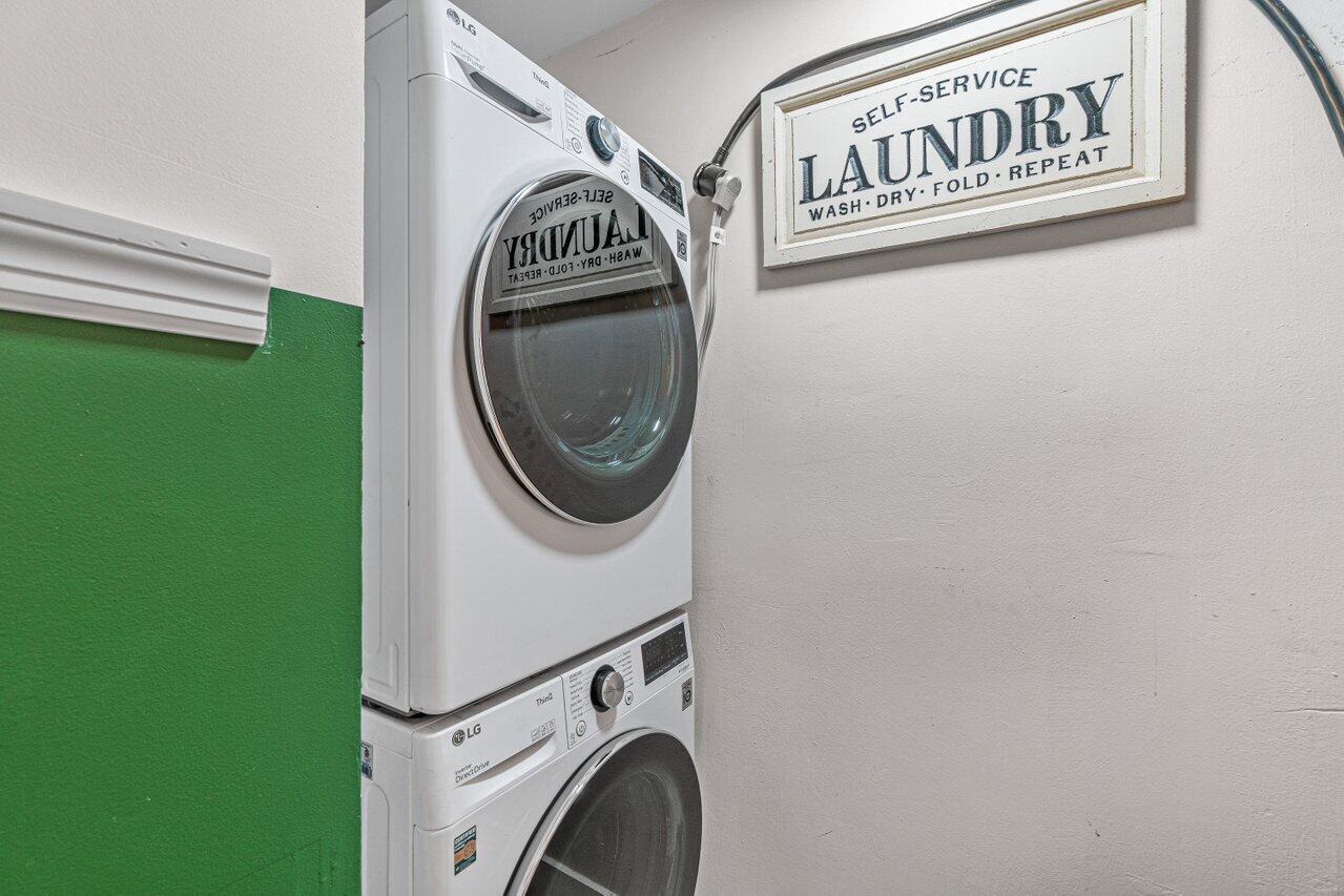 22172 Boca Rancho Drive, Unit D Boca Raton, FL 33428 - Photo 9 of 15 a utility room with dryer and washer