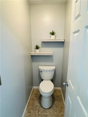a bathroom with a toilet and a sink