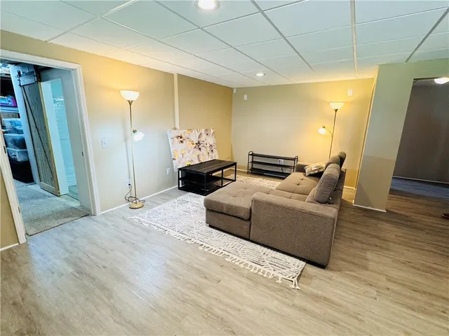 a bedroom with a bed and a mirror