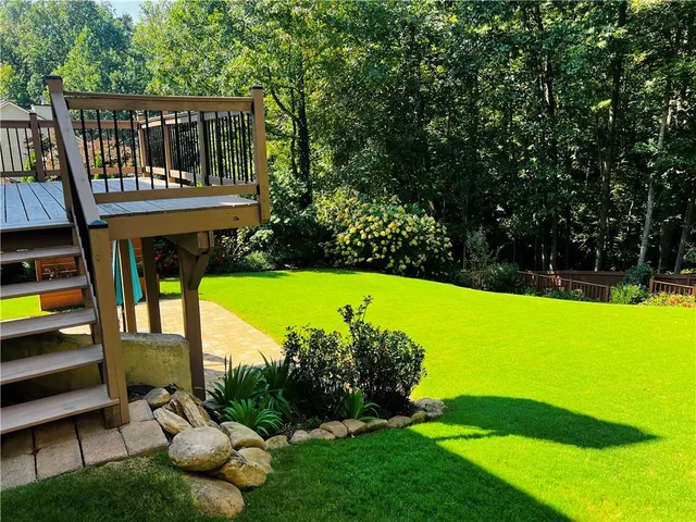 a view of a house with backyard porch and sitting area
