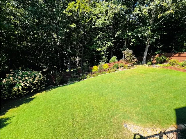 a view of a yard with swimming pool