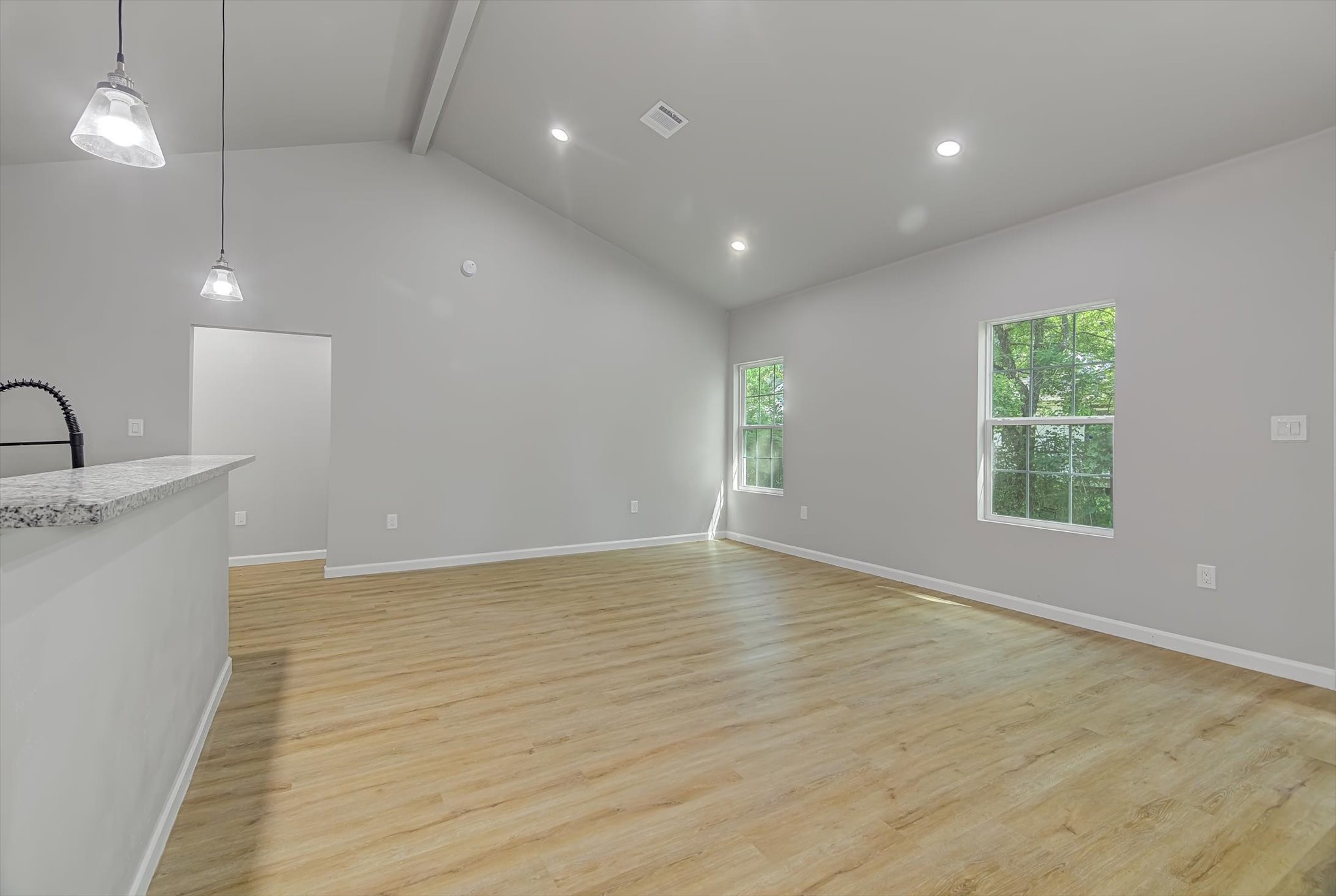 2355 Pecan Street Beaumont, TX 77701 - Photo 12 of 34 an empty room with wooden floor and windows