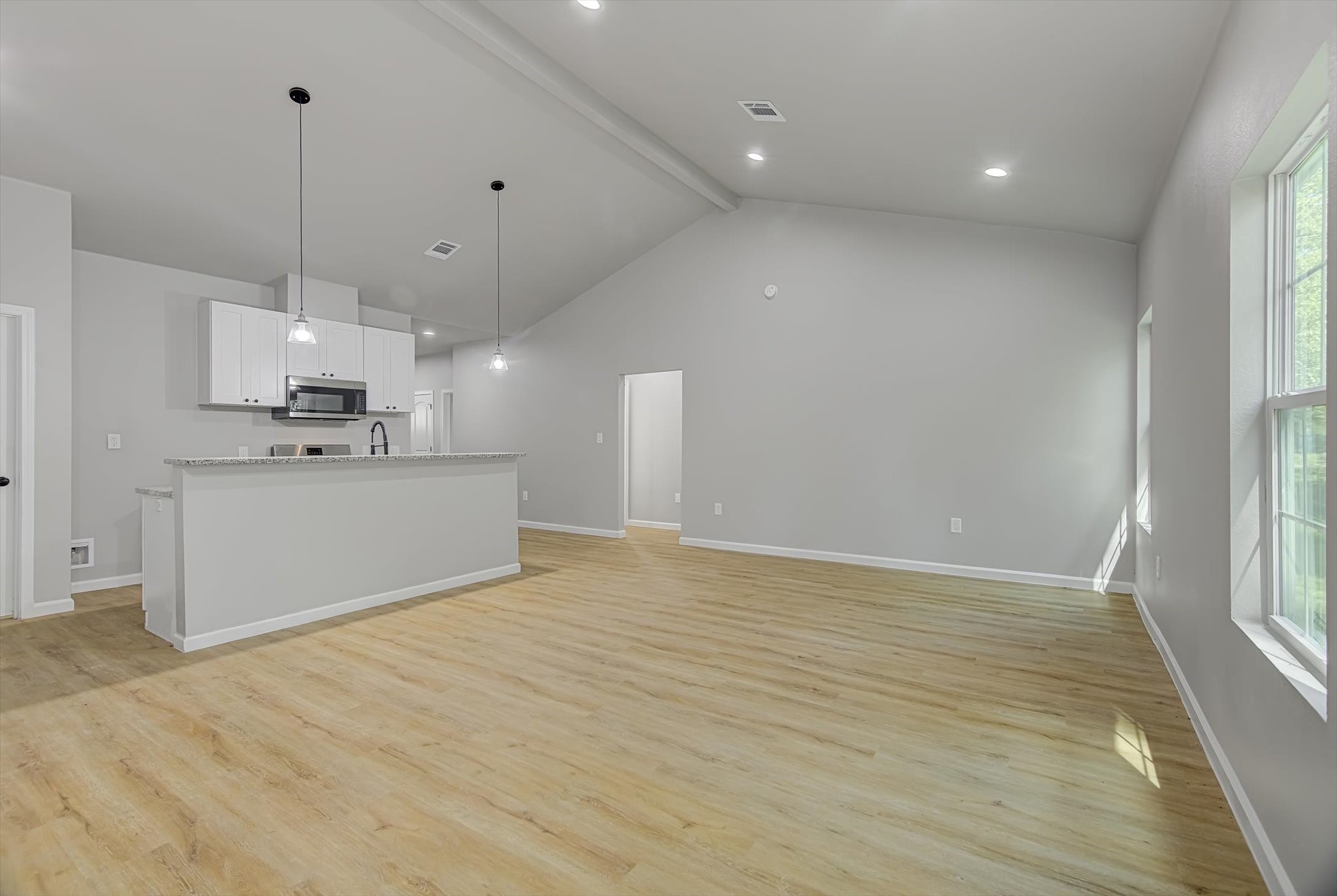 2355 Pecan Street Beaumont, TX 77701 - Photo 13 of 34 a view of a kitchen with a sink and microwave