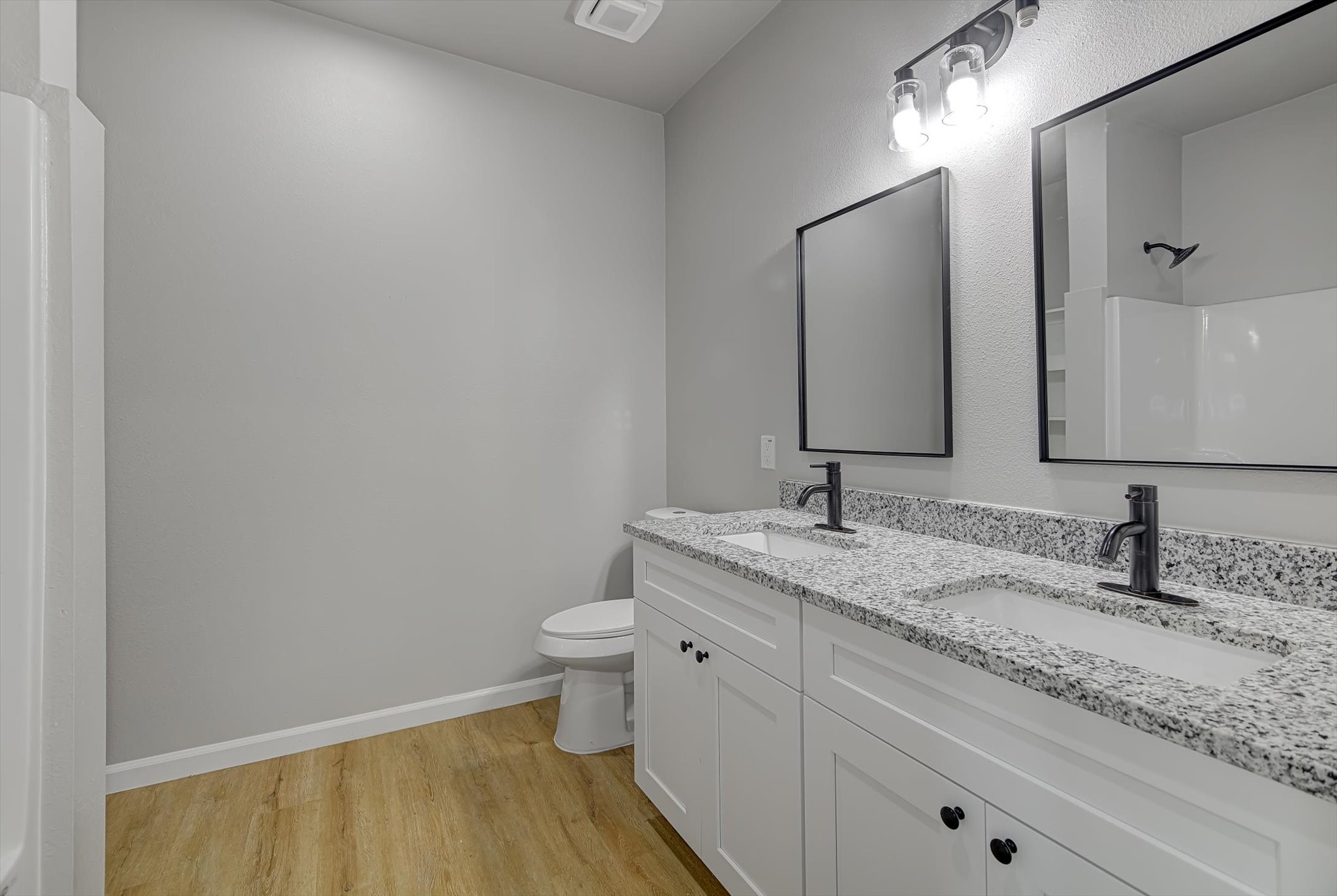 2355 Pecan Street Beaumont, TX 77701 - Photo 22 of 34 a bathroom with a granite countertop sink and a mirror