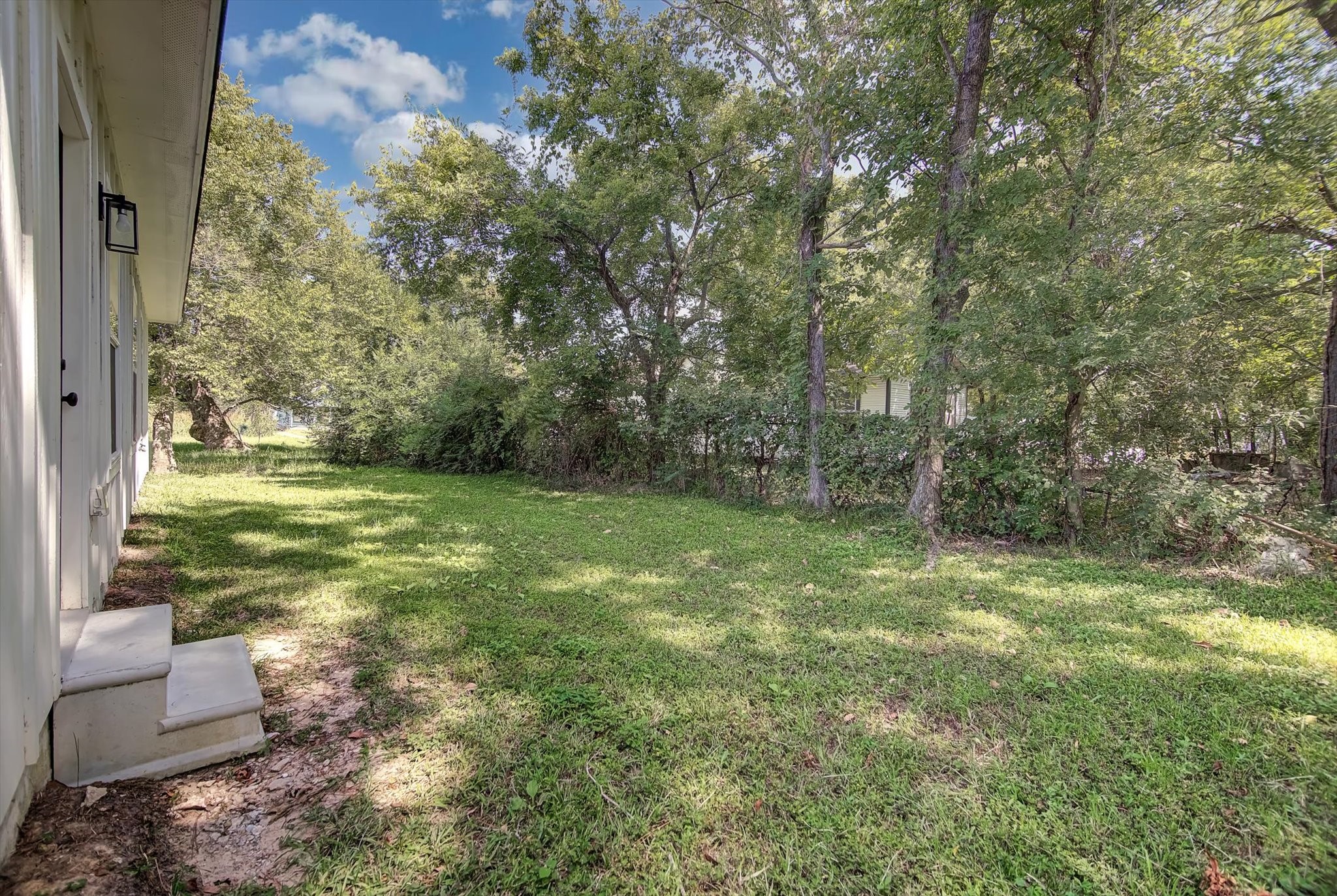 2355 Pecan Street Beaumont, TX 77701 - Photo 32 of 34 a view of a yard with large trees