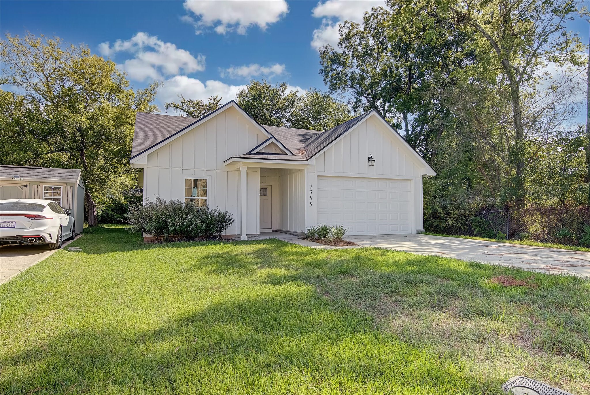 2355 Pecan Street Beaumont, TX 77701 - Photo 4 of 34 a front view of a house with a garden and yard