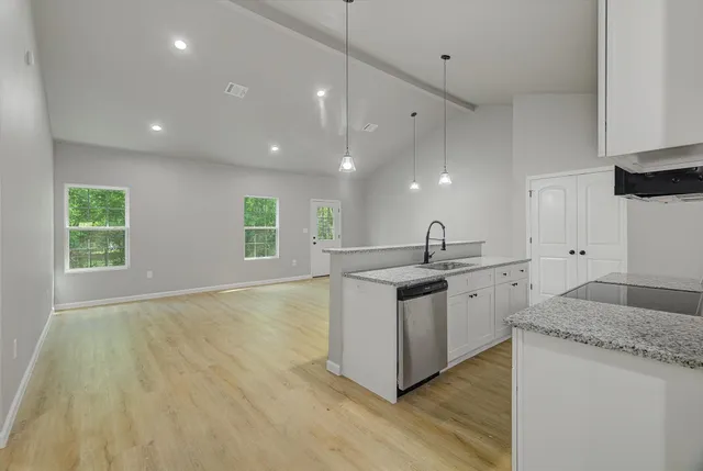 a kitchen with sink and window