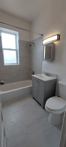 a bathroom with a toilet sink and bathtub