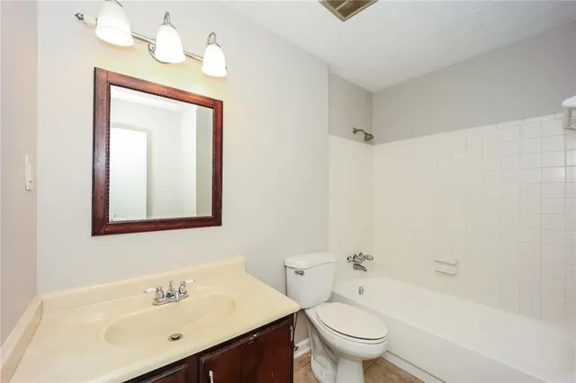 a bathroom with a toilet and a sink