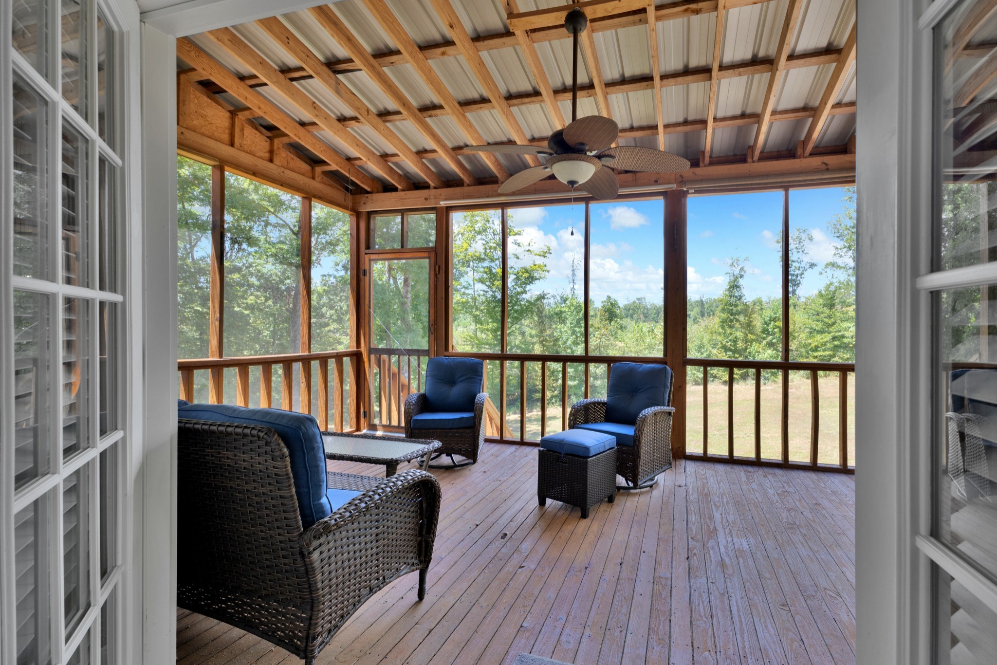 123 Lower Roans Creek Road Linden, TN 37096 - Photo 12 of 33 a living room with furniture a ceiling fan and a large window