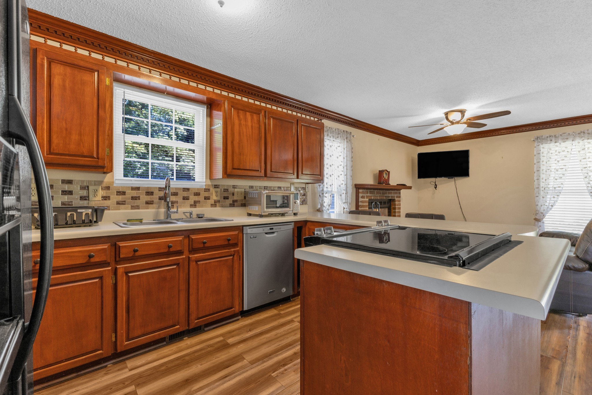123 Lower Roans Creek Road Linden, TN 37096 - Photo 17 of 33 a kitchen with stainless steel appliances granite countertop a sink stove and cabinets