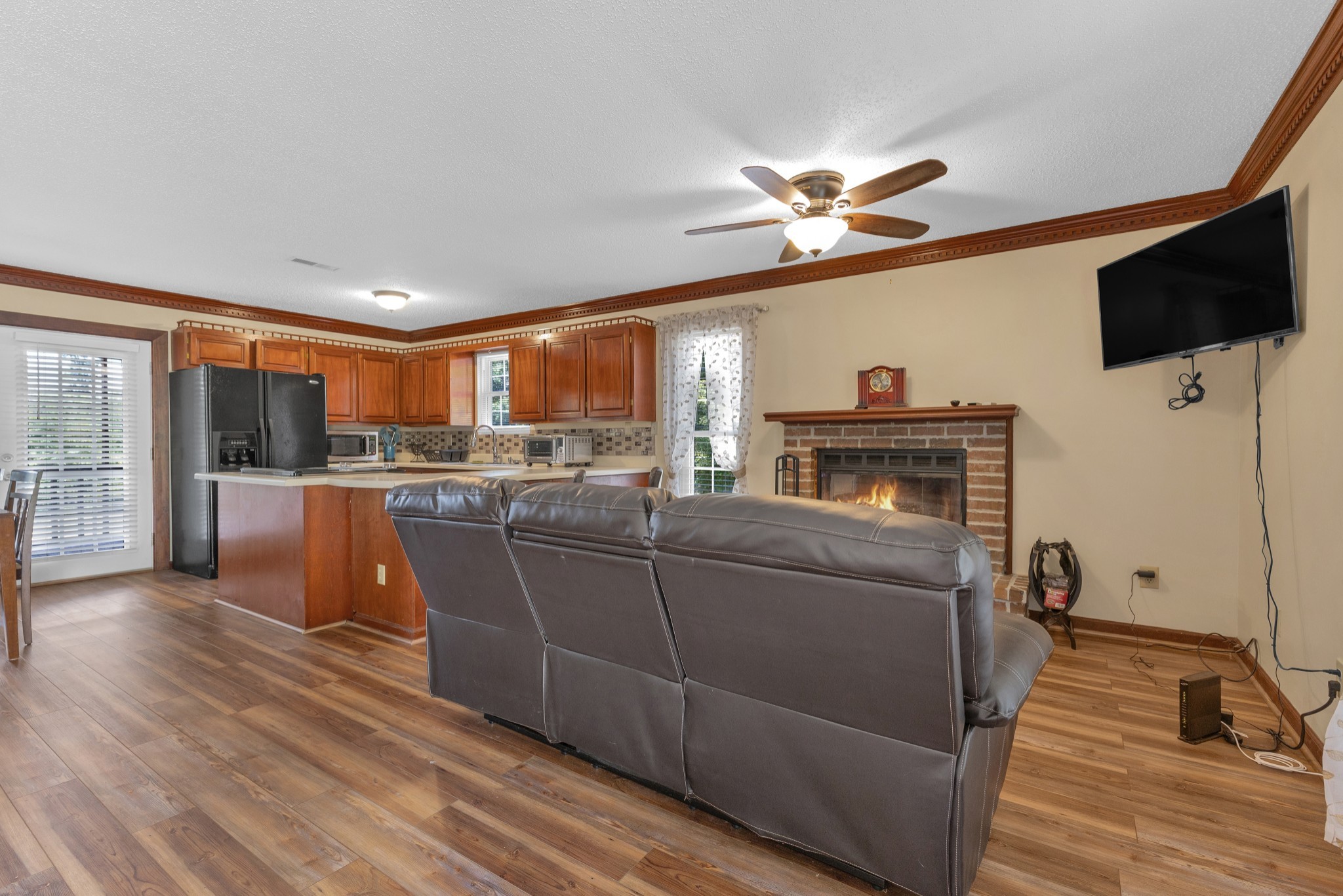 123 Lower Roans Creek Road Linden, TN 37096 - Photo 20 of 33 a living room with furniture and a flat screen tv