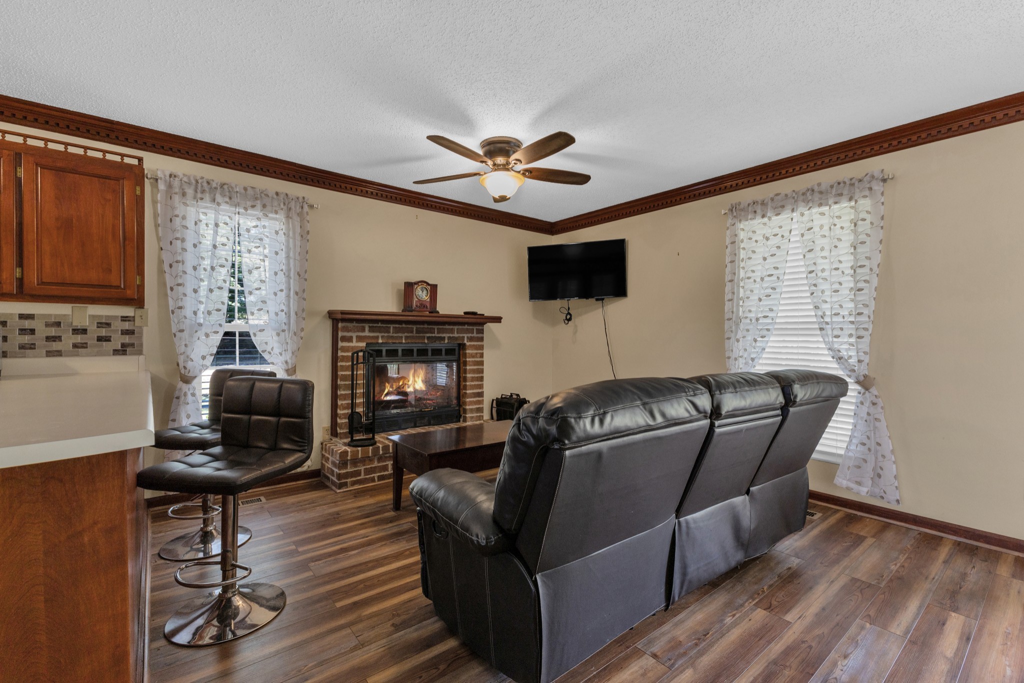 123 Lower Roans Creek Road Linden, TN 37096 - Photo 21 of 33 a living room with furniture and a fireplace
