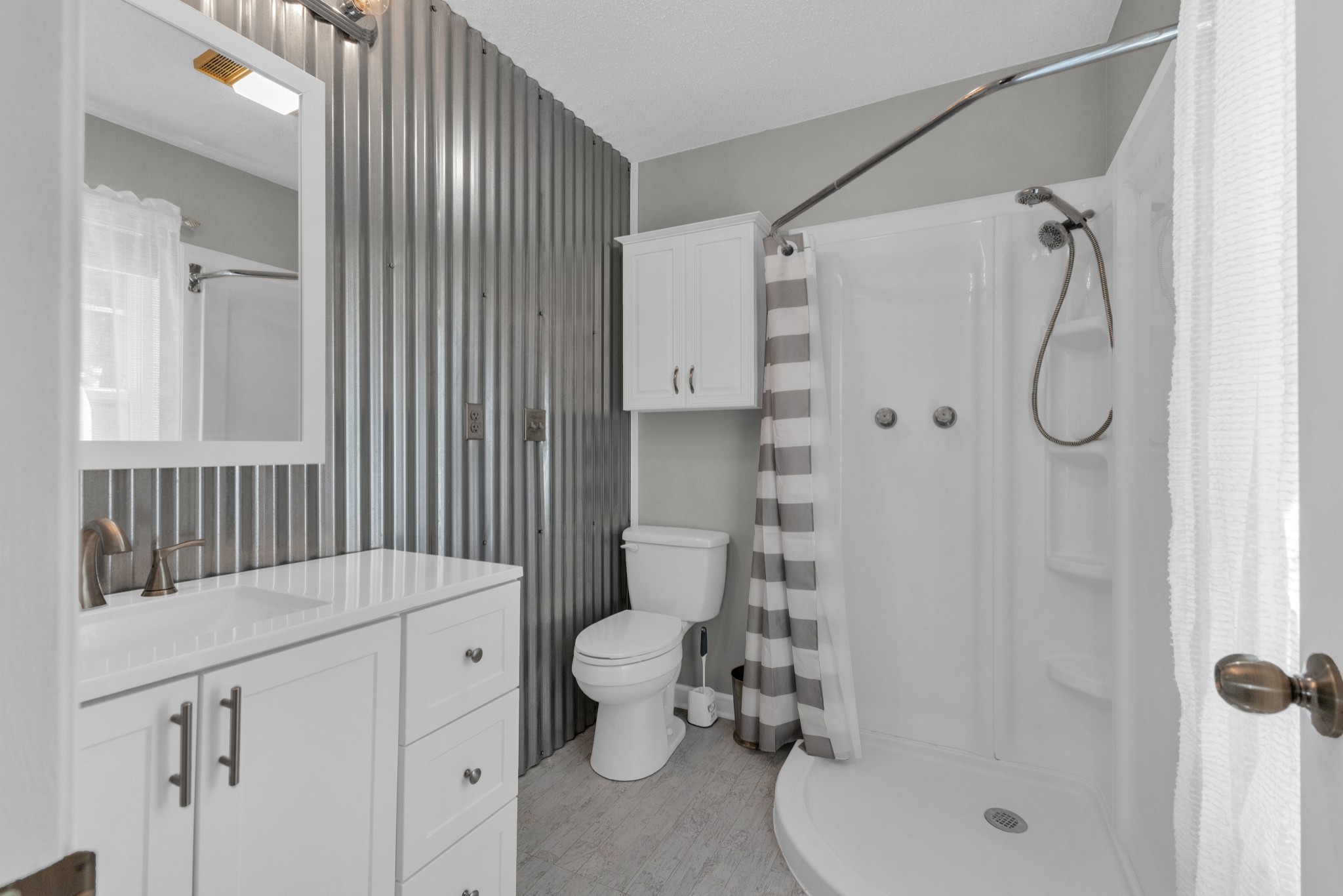 123 Lower Roans Creek Road Linden, TN 37096 - Photo 24 of 33 a bathroom with a sink toilet and shower