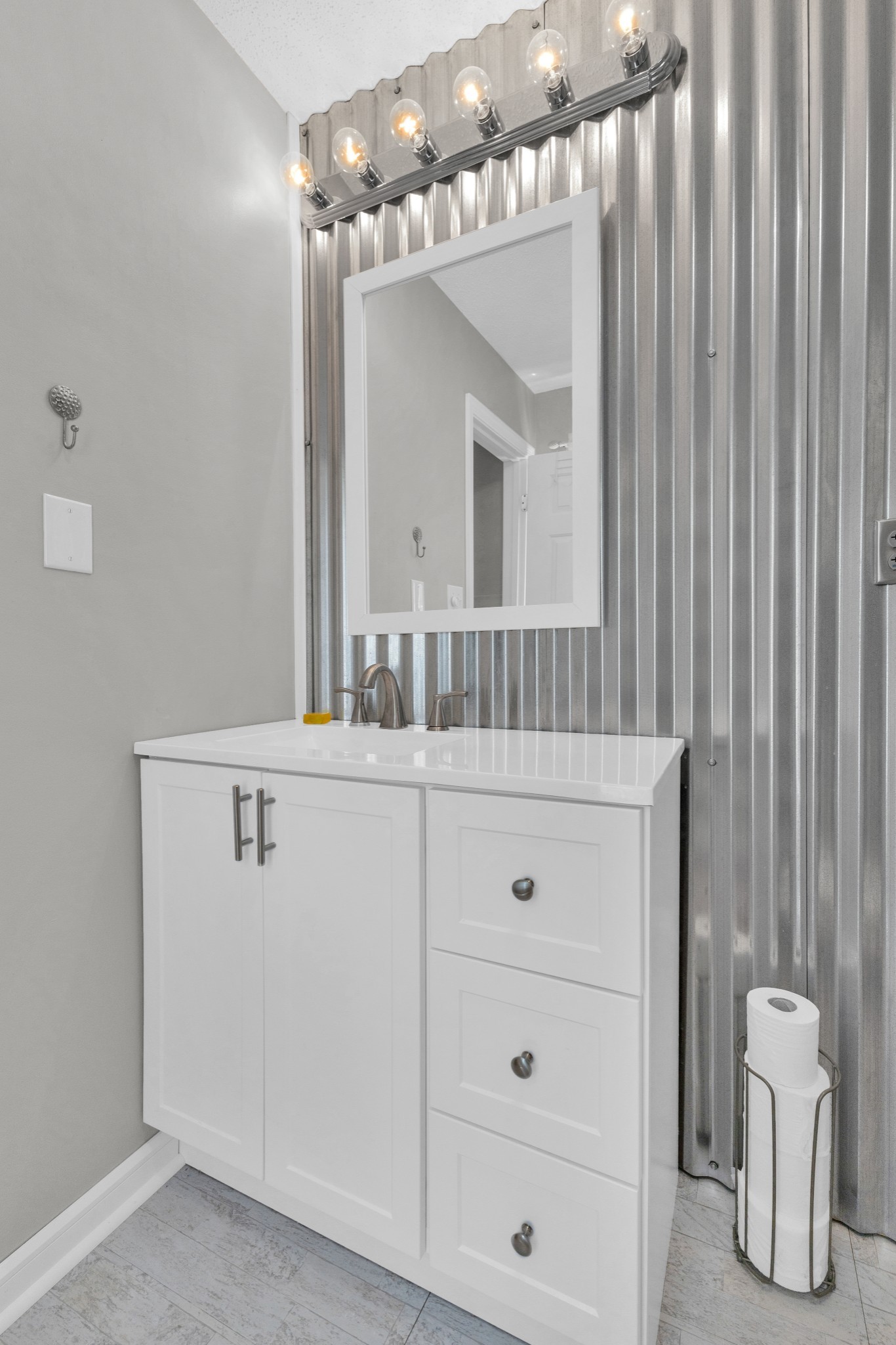 123 Lower Roans Creek Road Linden, TN 37096 - Photo 25 of 33 a bathroom with a sink a mirror and vanity