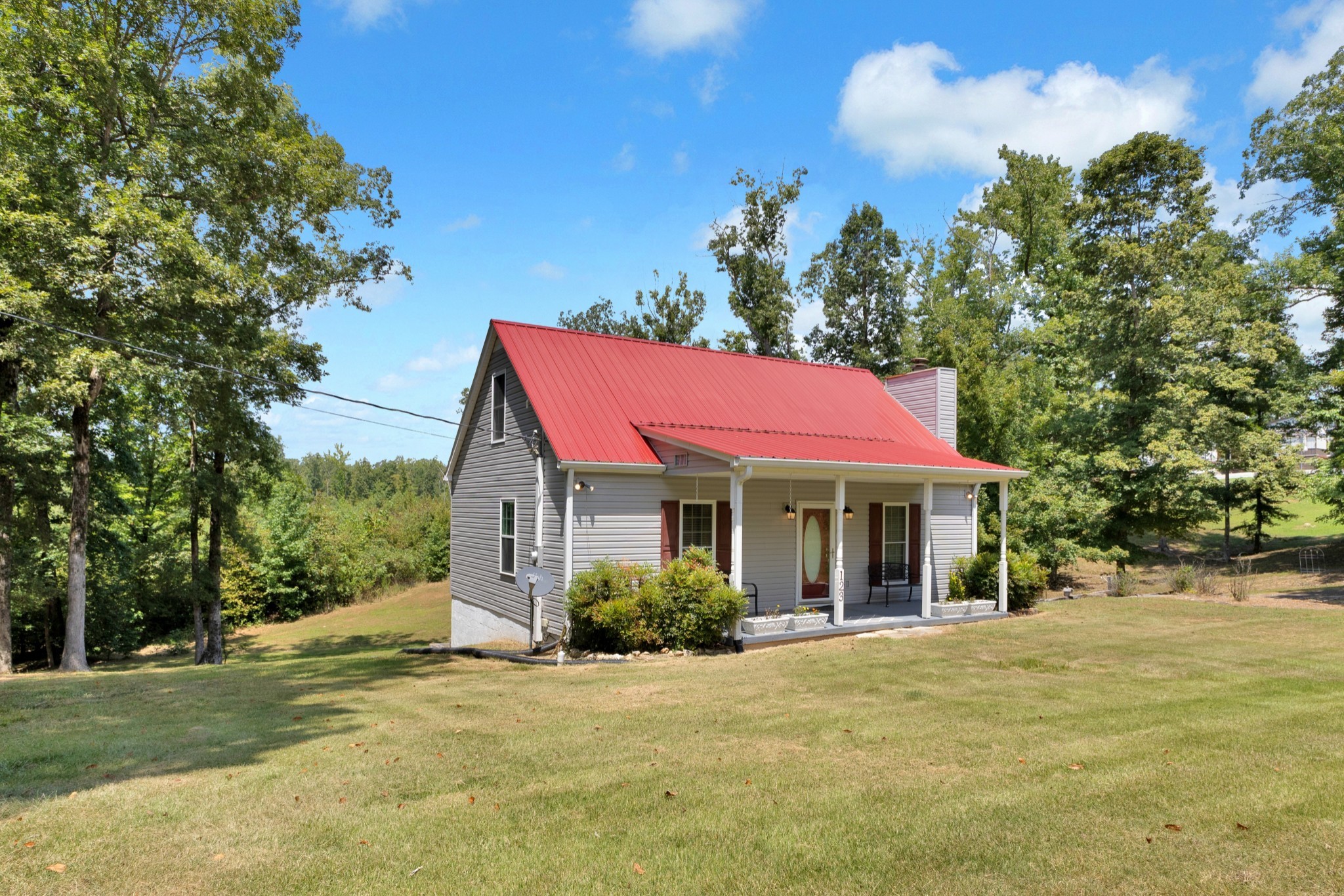 123 Lower Roans Creek Road Linden, TN 37096 - Photo 3 of 33 a view of a house with a yard and tree s