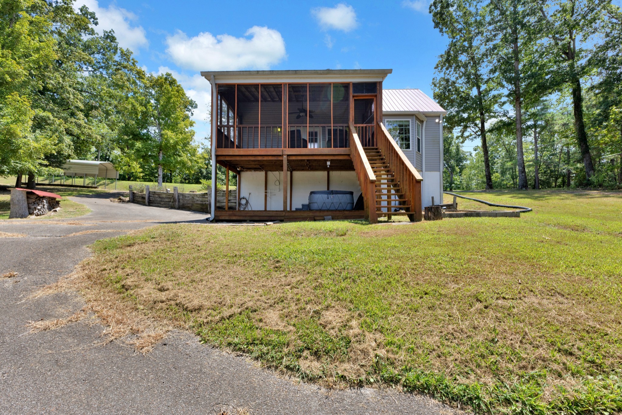123 Lower Roans Creek Road Linden, TN 37096 - Photo 10 of 33 a view of a house with backyard and a tree