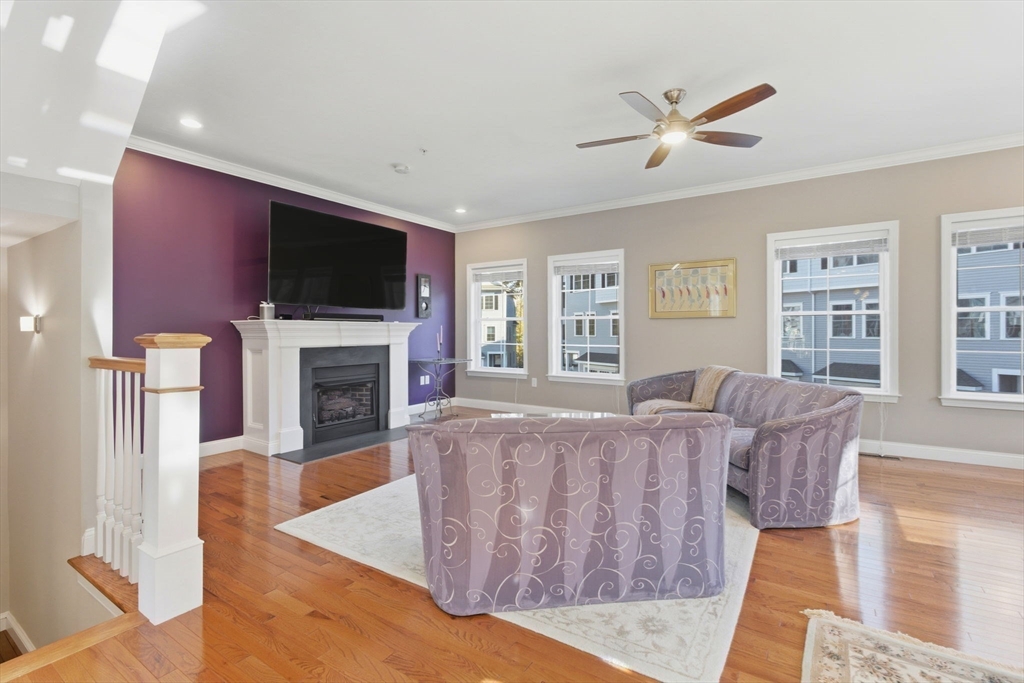 66 Compass Point, Unit 66 North Andover, MA 01845 - Photo 22 of 42 a living room with furniture fireplace and flat screen tv