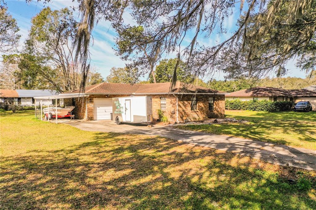 8510 North Campbell Road Lakeland, FL 33810 - Photo 2 of 15 a view of a house with pool and sitting area