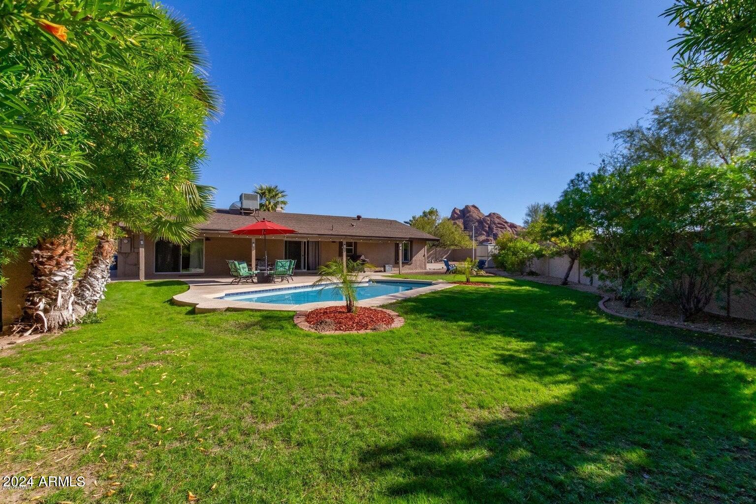 2350 North 55th Street Phoenix, AZ 85008 - Photo 17 of 20 a view of a house with a yard deck and a slide