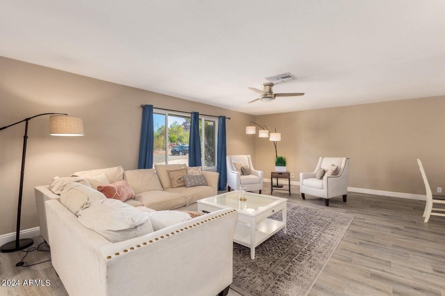2350 North 55th Street Phoenix, AZ 85008 - Photo 6 of 20 a living room with furniture and a large window