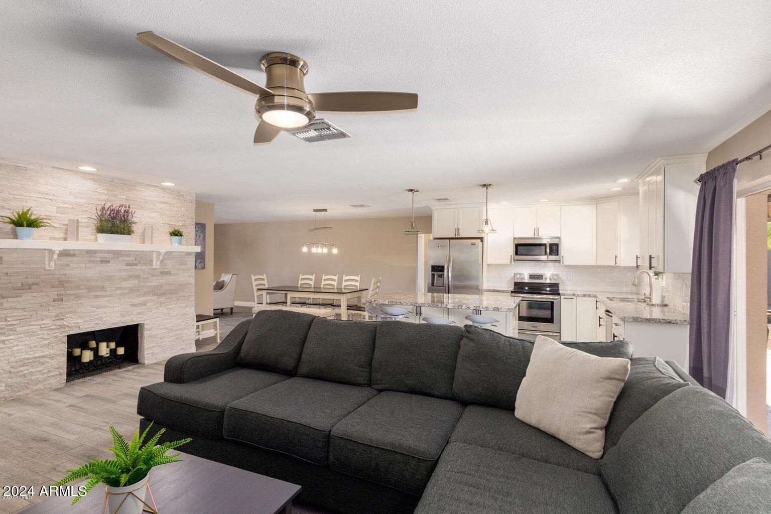 2350 North 55th Street Phoenix, AZ 85008 - Photo 8 of 20 a living room with furniture and a fireplace