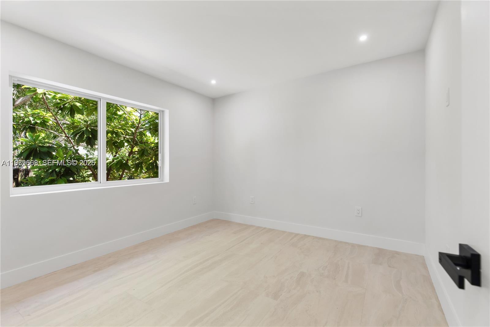 2251 Southwest 20th Street Miami, FL 33145 - Photo 20 of 36 an empty room with a window