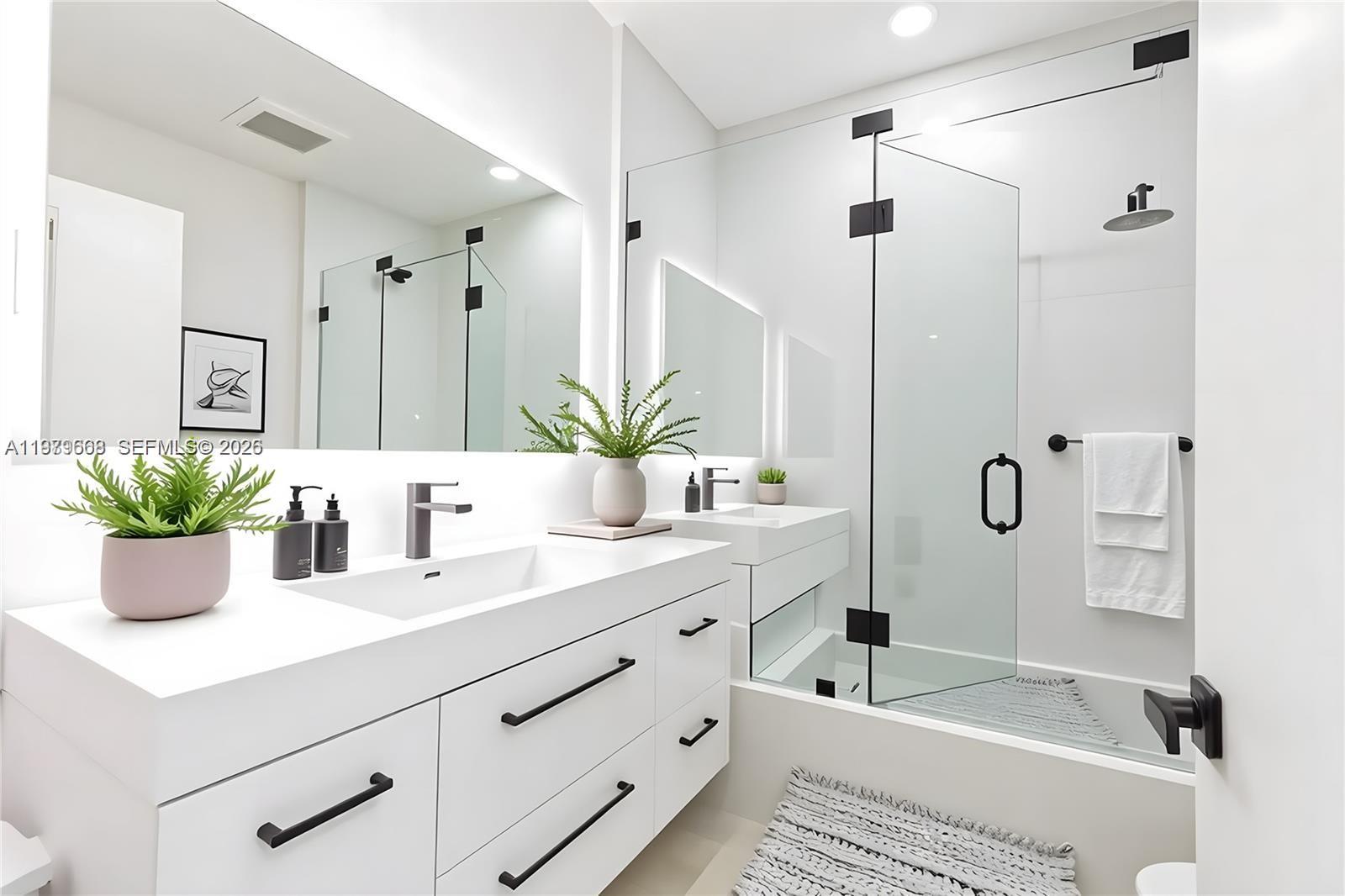 2251 Southwest 20th Street Miami, FL 33145 - Photo 27 of 36 a bathroom with a tub sink and mirror