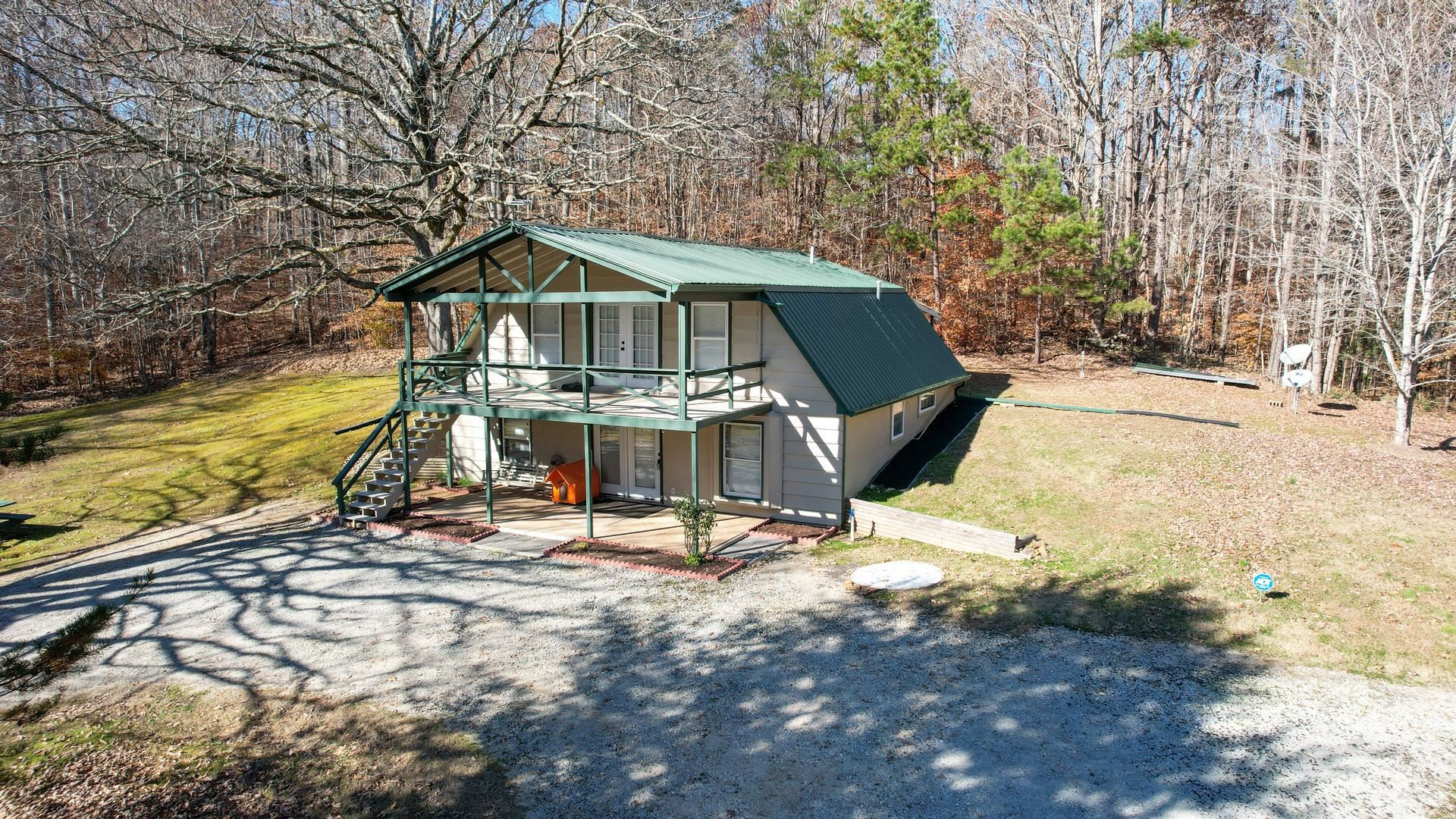 3520 Silerton Road Henderson, TN 38340 - Photo 1 of 24 a view of a house with large trees and sitting area