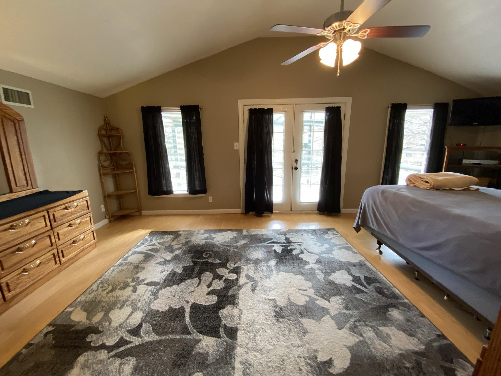 3520 Silerton Road Henderson, TN 38340 - Photo 11 of 24 a bedroom with a bed and a chandelier
