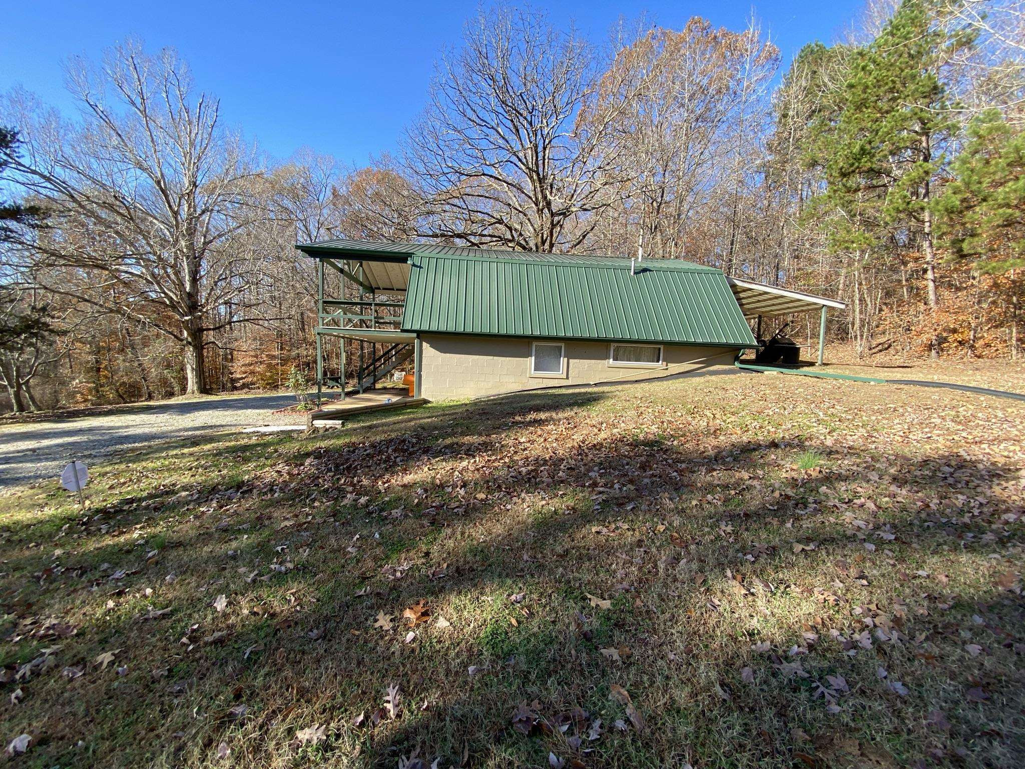 3520 Silerton Road Henderson, TN 38340 - Photo 23 of 24 a view of a yard with plants and a large tree
