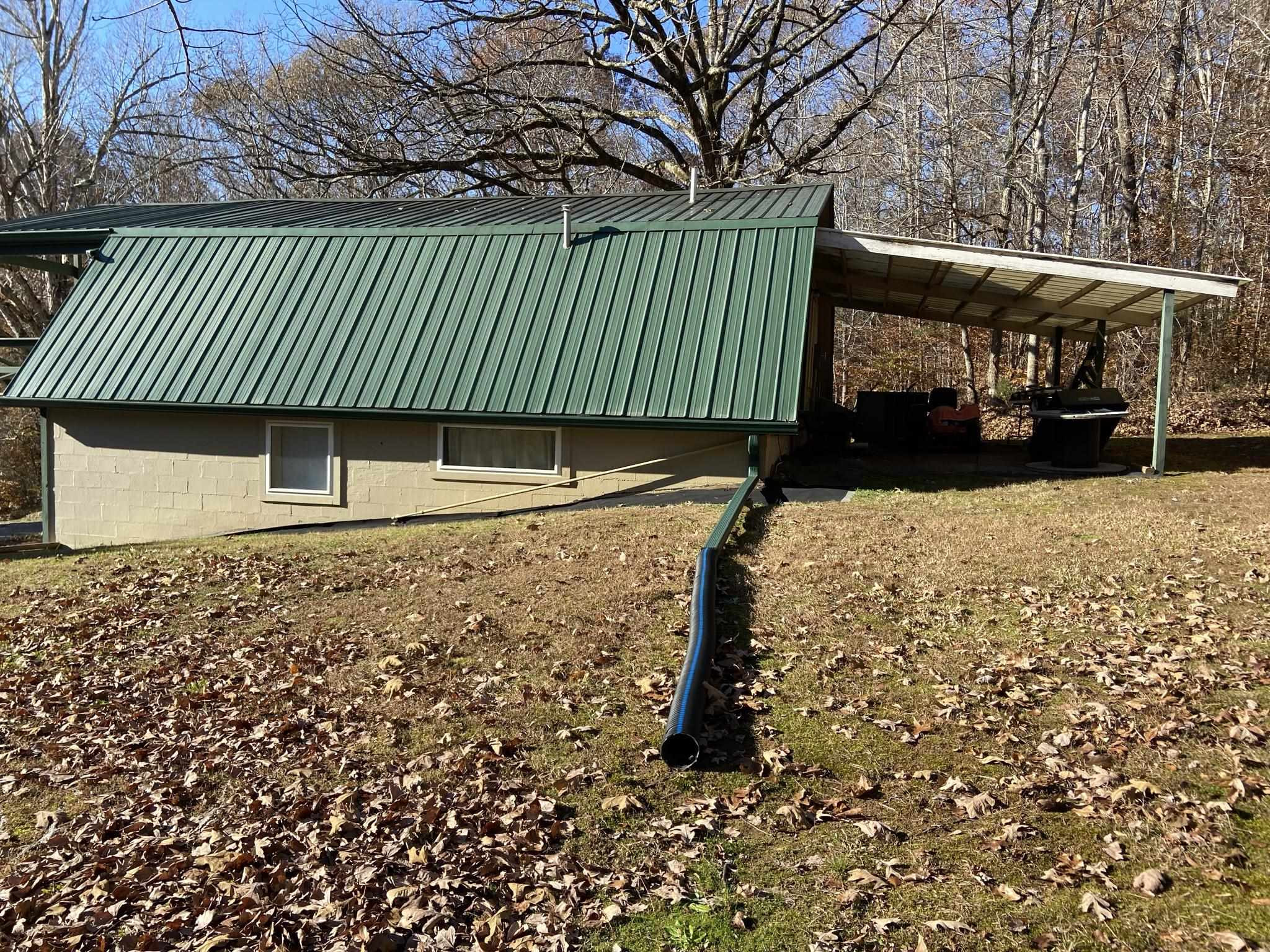 3520 Silerton Road Henderson, TN 38340 - Photo 24 of 24 a side view of a house with a yard