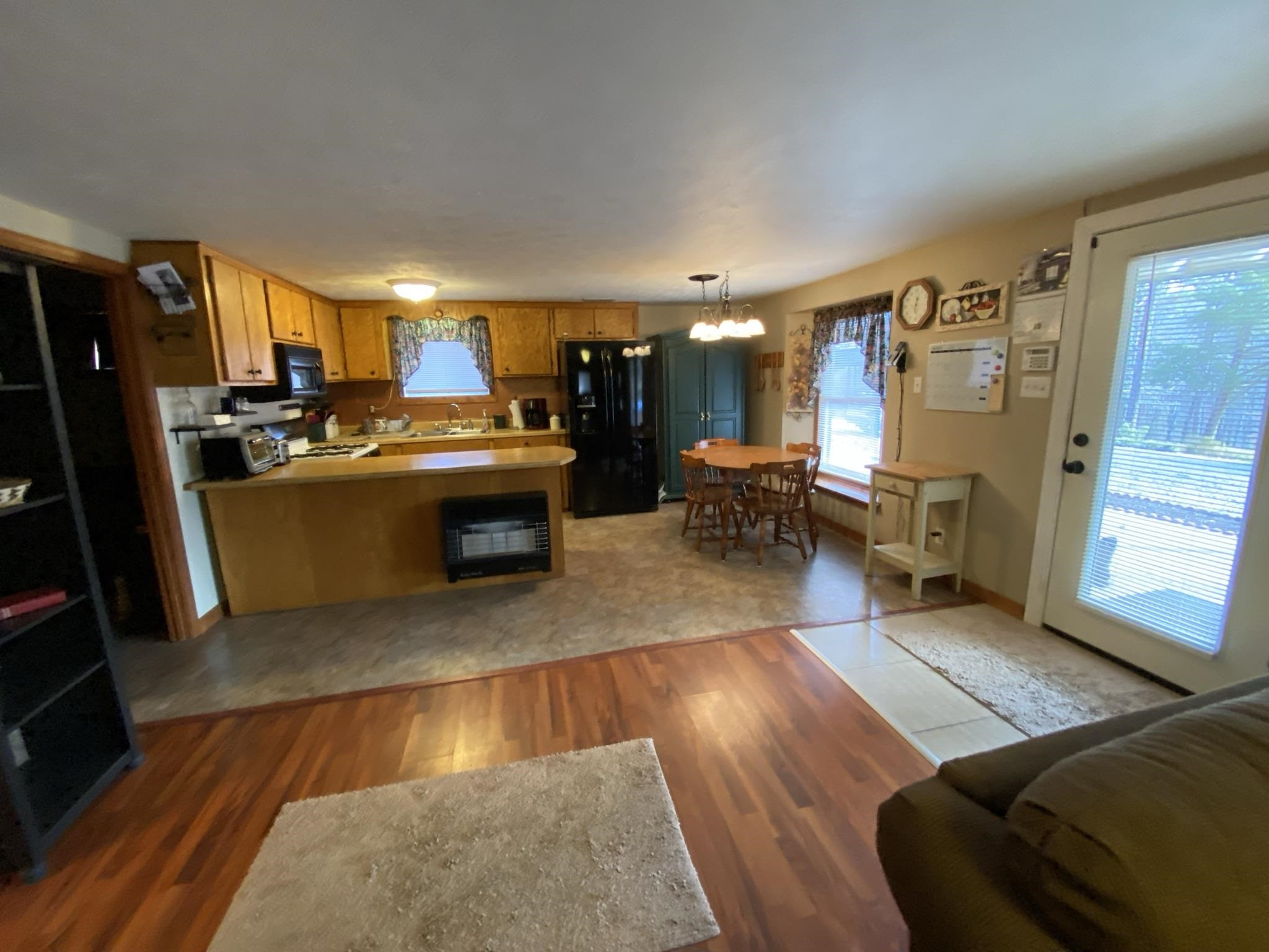 3520 Silerton Road Henderson, TN 38340 - Photo 3 of 24 a living room with stainless steel appliances furniture a rug and a view of kitchen