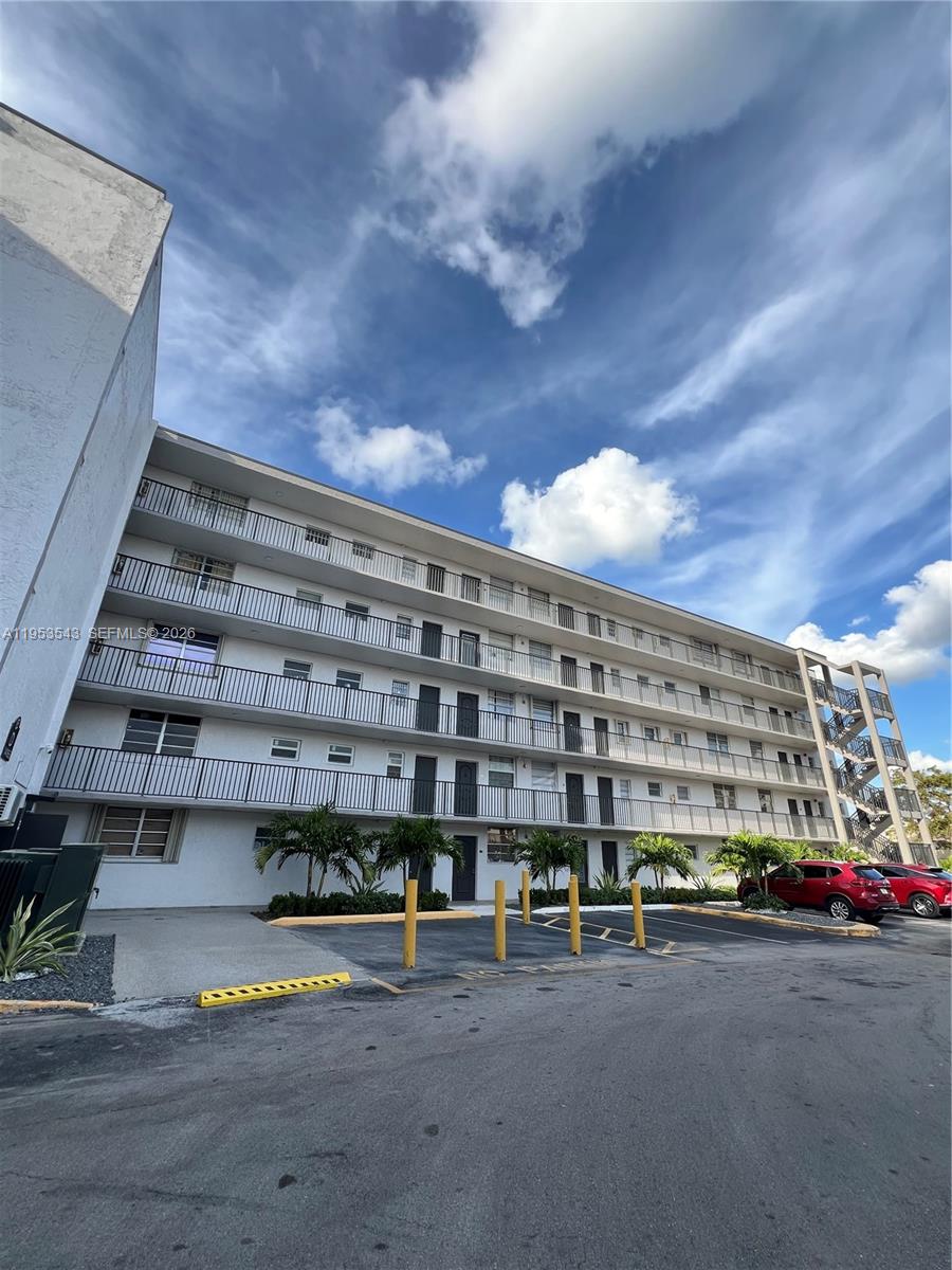 a tall building with view of street