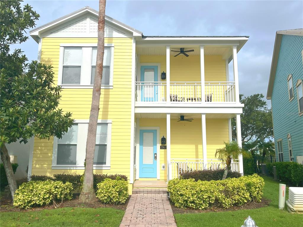 7762 Linkside Loop Reunion, FL 34747 - Photo 1 of 1 a front view of a house having yard
