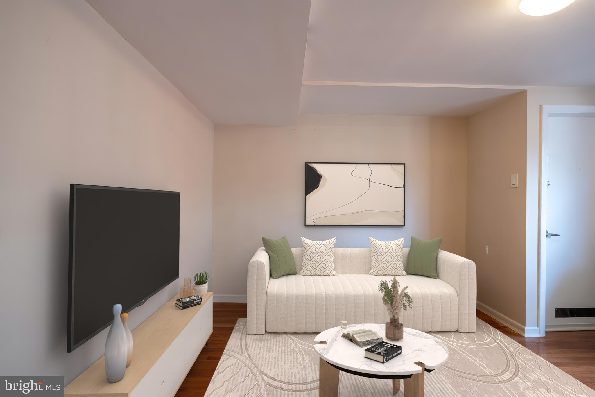 1736 Pine Street, Unit 3R Philadelphia, PA 19103 - Photo 2 of 14 a living room with furniture and a flat screen tv