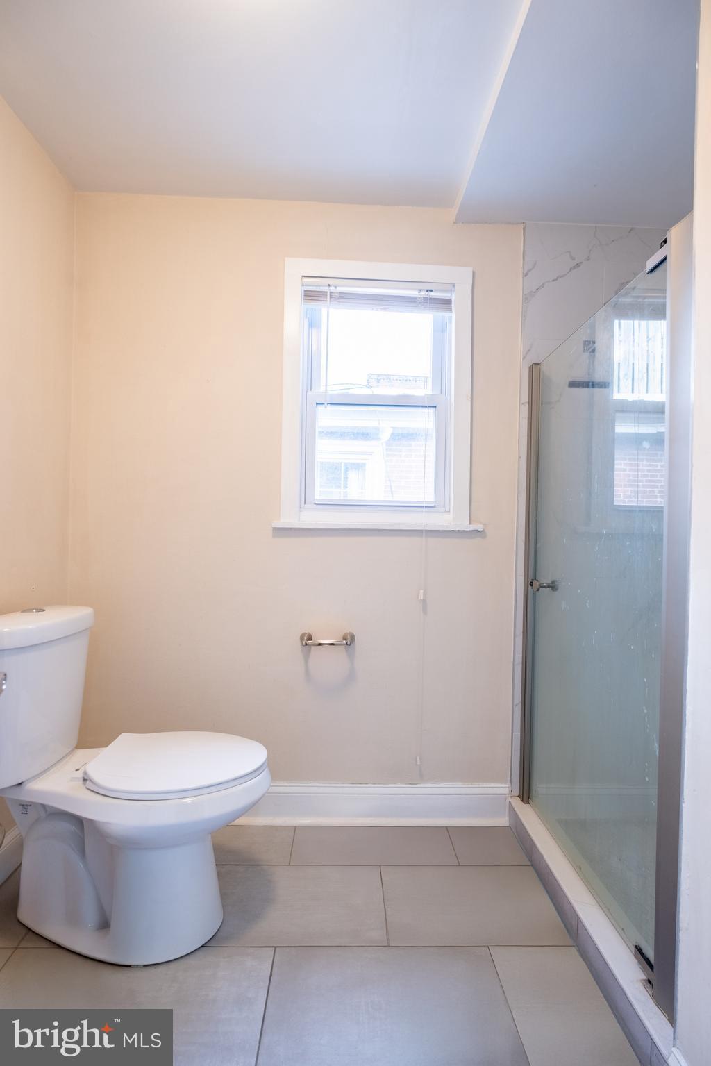 1736 Pine Street, Unit 3R Philadelphia, PA 19103 - Photo 8 of 14 a bathroom with a toilet and a shower