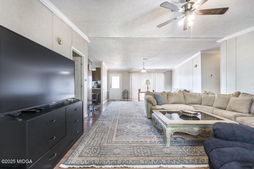 100 Coventry Manor Court Byron, GA 31008 - Photo 11 of 29 a living room with furniture and wooden floor