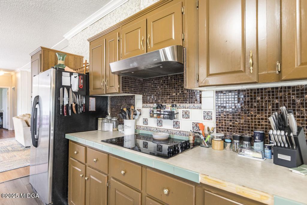 100 Coventry Manor Court Byron, GA 31008 - Photo 14 of 29 a kitchen with a sink and cabinets