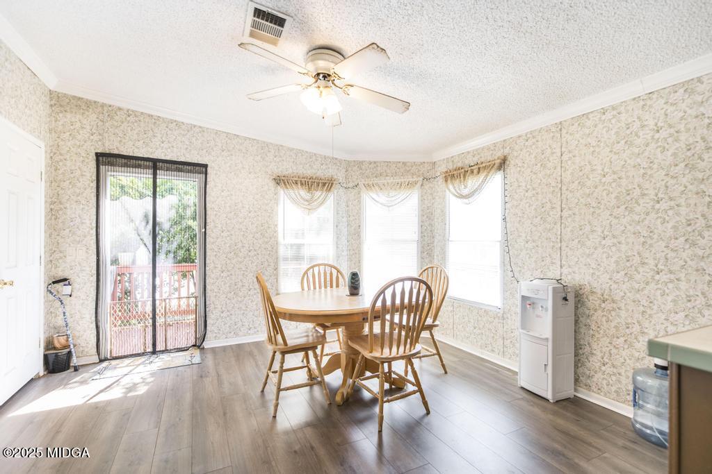 100 Coventry Manor Court Byron, GA 31008 - Photo 16 of 29 a view of a dining room with furniture window and wooden floor